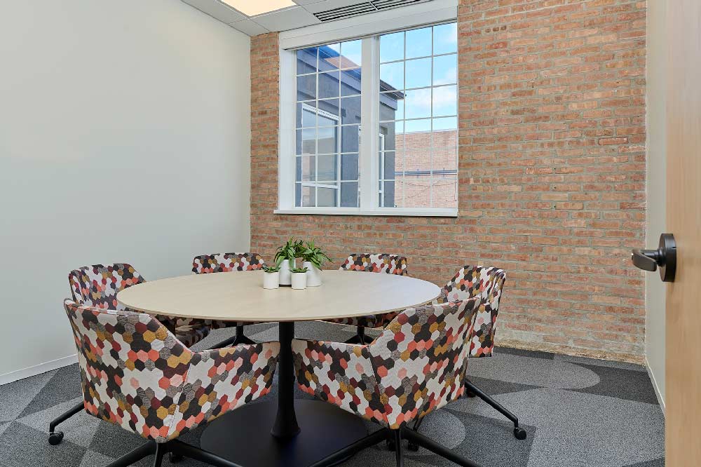 Villa workplace breakout room exposed brick wall interior design